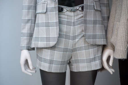 Closeup of classic mini short on mannequin in a fashion store showroom