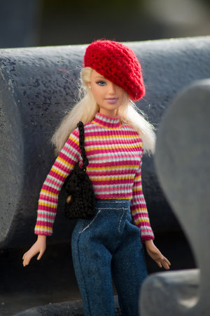 Mulhouse - France - 10 March 2021 - Portrait of blond barbie doll wearing a blue jeans pants and red...