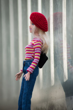 Mulhouse - France - 10 March 2021 - Portrait of blond barbie doll wearing a blue jeans pants and red...