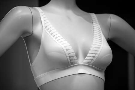Closeup of white bra on mannequin in a fashion store showroomの写真素材