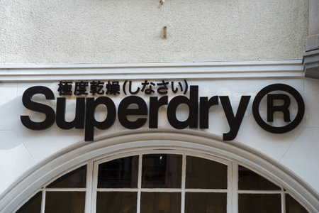 Colmar - France - 14 March 2021 - Closeup of Superdry sign on store front in the streetのeditorial素材