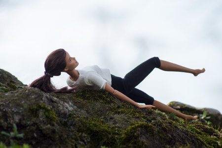 Mulhouse - France - 19 March 2021 - Portrait of brunette Barbie doll practice fitness in a public gardenのeditorial素材