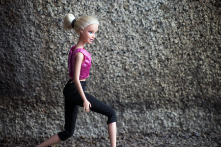 Mulhouse - France - 15 March 2021 - Portrait of blond Barbie doll practice fitness in the streetのeditorial素材