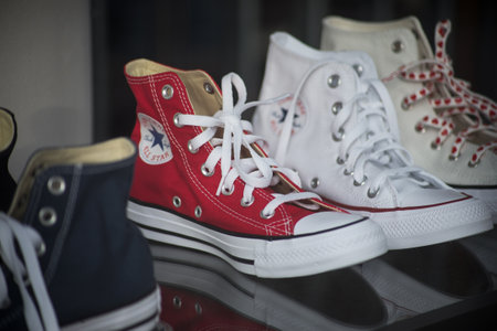 Mulhouse - France - 20 March 2021 - Closeup of vintage sneakers collection by Converse in a fashion store showroomのeditorial素材