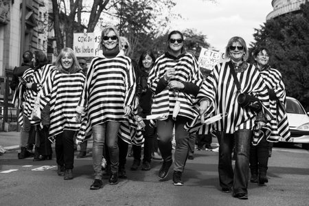 Mulhouse - France - 27 March 2021 - people  protesting against the sanitary dictatorship wearing  prisoner costume and handcuffsのeditorial素材