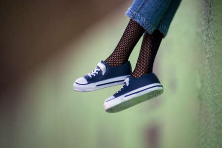 Closeup of blue sneakers on mannequin doll in the streetの写真素材