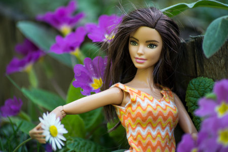 Mulhouse - France - 31 March 2021 - Portrait of brunette Barbie doll sitting in a public gardenのeditorial素材