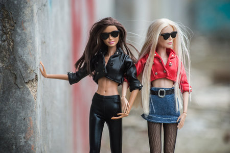 Mulhouse - France - 6 May 2021 - Portrait of two Barbie dolls wearing red and black leather jacket...