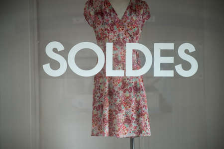 discount sign SOLDES  in french,  the traduction of  (sales ) on window in french fashion store...