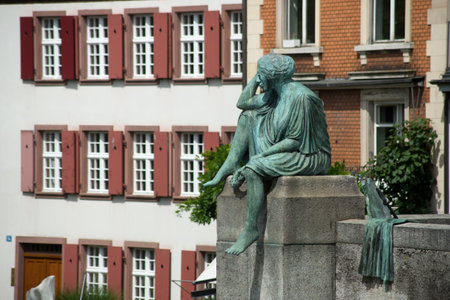 Basel - Switzerland - 6 August 2021 - view of bronze statue in border the rhine riverのeditorial素材
