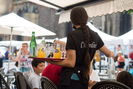 Colmar - France - 13 August 2021 - portrait of waitress at the cafe terrace in the streetのeditorial素材