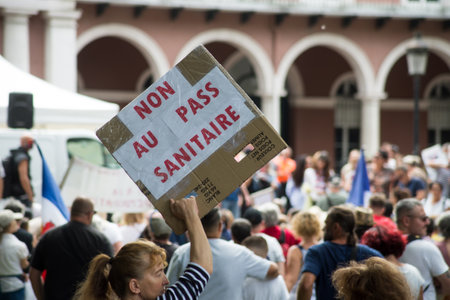 Mulhouse - France - 31 July 2021 -  people protesting in the street against the sanitary pass, with banner in french, non au pass, in english , no passのeditorial素材