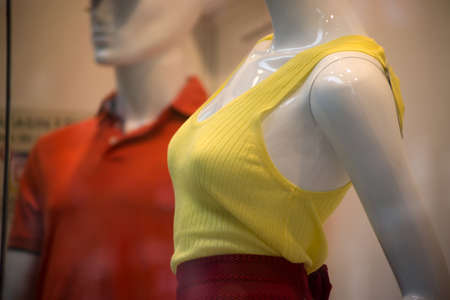 Closeup of yellow top on mannequin in a fashion store showroomの写真素材