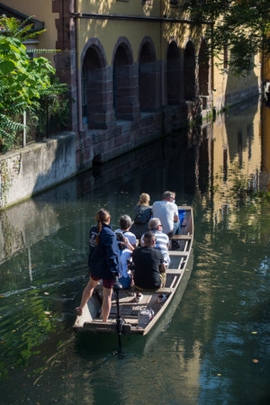 Colmar - France - 4 September 2021 - Boat trip tourism on water at little Venice quarterのeditorial素材