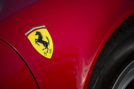 Mulhouse - France - 12 September 2021 - Closeup of ferrari logo on red luxury sport car parked in the streetのeditorial素材