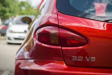 Mulhouse - France - 8 August 2021 - Rear view of red alpha romeo V8  car parked in the streetのeditorial素材