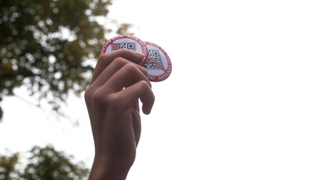 Strasbourg - France - 16 October 2021 - closeup of hand of girl protesting against the sanitary pass with qr code badges and text in french : non au pass sanitaire, in english : no sanitary passのeditorial素材