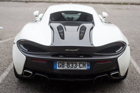 Mulhouse - France - 10 October 2021 - Rear view of white mc laren sport car parked in the street