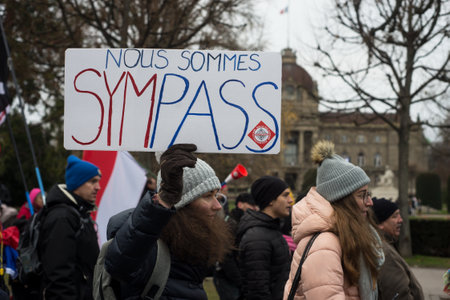 Strasbourg - France - 18 December 2021 -  people protesting in the street with placard in french : nous sommes sympas, in english we are coolのeditorial素材