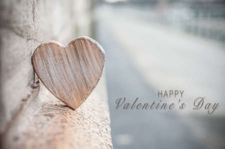 closeup of wooden heart in outdoor - Love concept - Valentine's Day greeting cardの写真素材