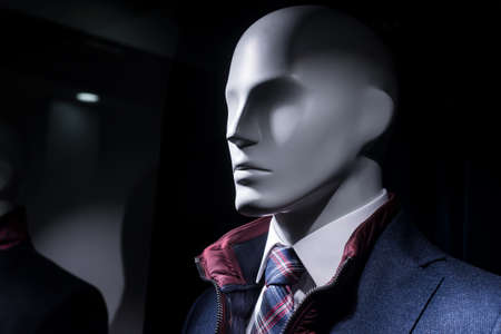 Closeup of mannequin in a fashion store showroom for menの写真素材