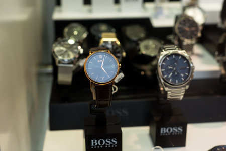 Colmar - France - 2 January 2022 - Closeup of luxury watches by Hugo BOSS in a jewelry store showroomのeditorial素材