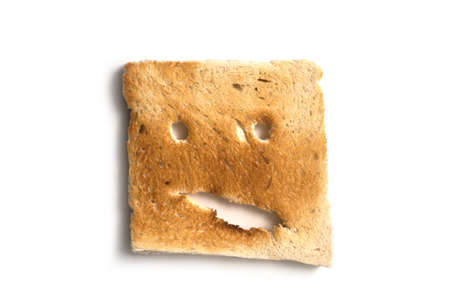 Closeup of expressive toasted slices of bread on white backgroundndの写真素材