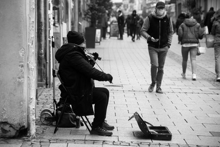 Strasbourg - France - 15 January 2022 - Portrait of violinist  playing in the streetのeditorial素材