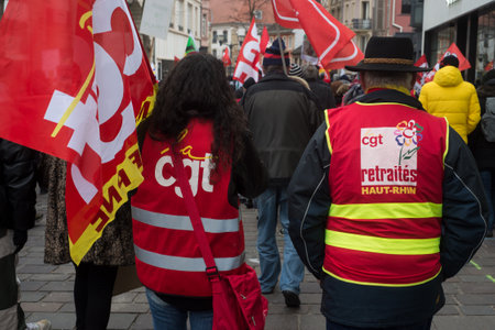 Mulhouse - France - 27 January 2022 - Portrait on back view of people protesting in thee street with CGT syndicate jacketのeditorial素材