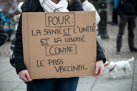 Strasbourg - France - 8 January 2022  - People protesting against the sanitary pass with text in french : contre le pass vaccinal, in english : against the vaccinal passのeditorial素材