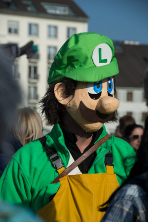 Basel - Switzerland - 9 March 2022 - portrait of masked people wearing traditional costume of...