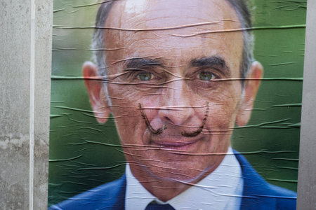 Colmar - France - 2 April 2022 - closeup of painted mustache on Eric Zemmour portrait, french canditate at the presidential election 2022のeditorial素材
