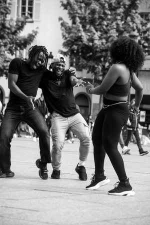 Strasbourg - France - 30 April 2022 - Portrait of african dancers smiling in the streetのeditorial素材