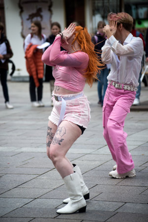 Strasbourg - France - 30 April 2022 - Portrait of red hairs girl dancing in the streetのeditorial素材