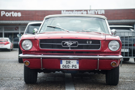 Lutterbach - France - 5 June 2022 - Front view of red Ford Mustang 1967 parked in the streetのeditorial素材