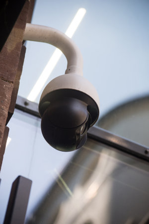 closeup of security camera on building facade