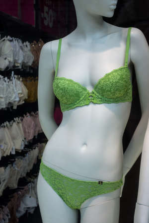 Closeup of green underwear on mannequin in a fashion store showroomの写真素材