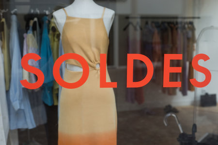 discount sign SOLDES  in french,  the traduction of  (sales ) on window in french fashion store...
