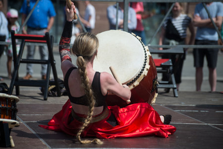 Strasbourg - France - 9 July 2022 - people wearing traditional costume playing japanese drums in the...