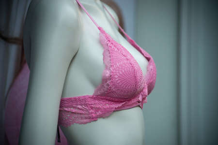Closeup of pink bra on mannequin in a fashion store for women showroom