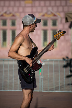 Mulhouse  France - 14 July 2022 - Portrait of musician playing electric guitar at the street scene festival in the streetのeditorial素材