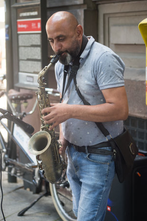 Strasbourg - France - 9 July 2022 - Portrait of man playing saxophone in the streetのeditorial素材