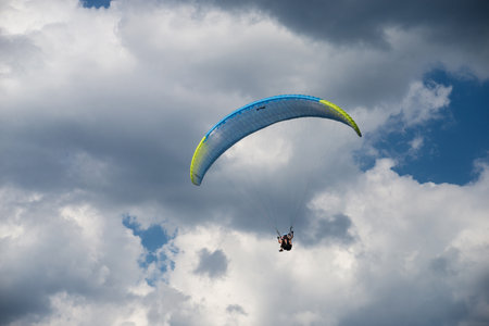 Le grand Ballon - France - 4 August  2022 - View of paraglider flying on cloudy sky backgroundのeditorial素材