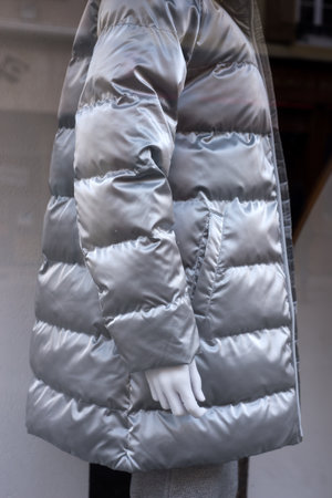 Closeup of grey winter coat on mannequin in a fashion store showroomの写真素材