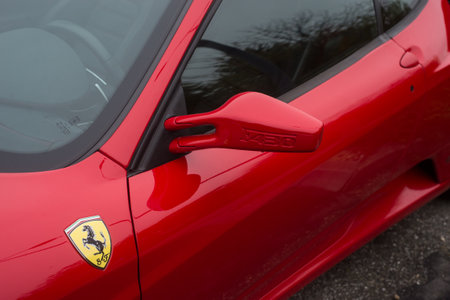 Mulhouse - France - 13 November 2022 - Closeup of red ferrari F430 mirror of red car parked in the streetのeditorial素材