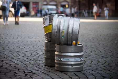 Strasbourg - France - 6 September 2023 - closeup of heineken beer container in front of bar on pavement in the streetのeditorial素材