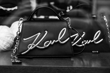 Mulhouse - France - 24 December 2023 - Closeup of black Karl Lagerfeld hand bag in a luxury fashion store showroomのeditorial素材