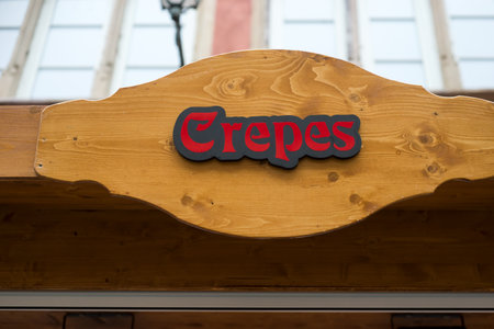 Closeup of crepes signage on wooden signboard in the street, traduction in english : pancakesの写真素材