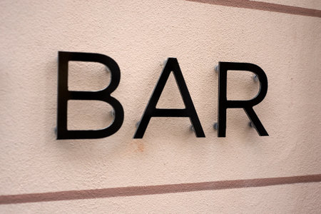 Closeup of bar signage on the wall in the streetの写真素材