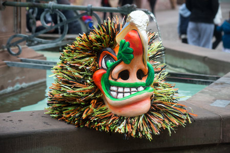 Mulhouse - France - 17 february 2024 - Closeup of traditional carnival masks posing on the floor  before the carnivalのeditorial素材